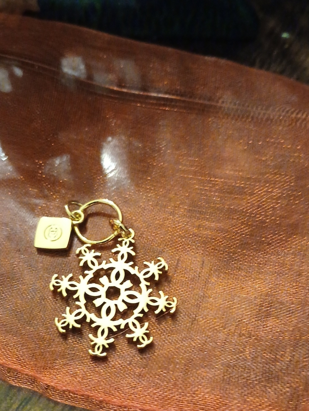 CHANEL Gold Snowflake Keychain with Logo Charm